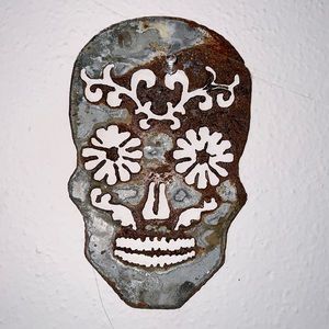 Vintage rusted metal “flower power skull”